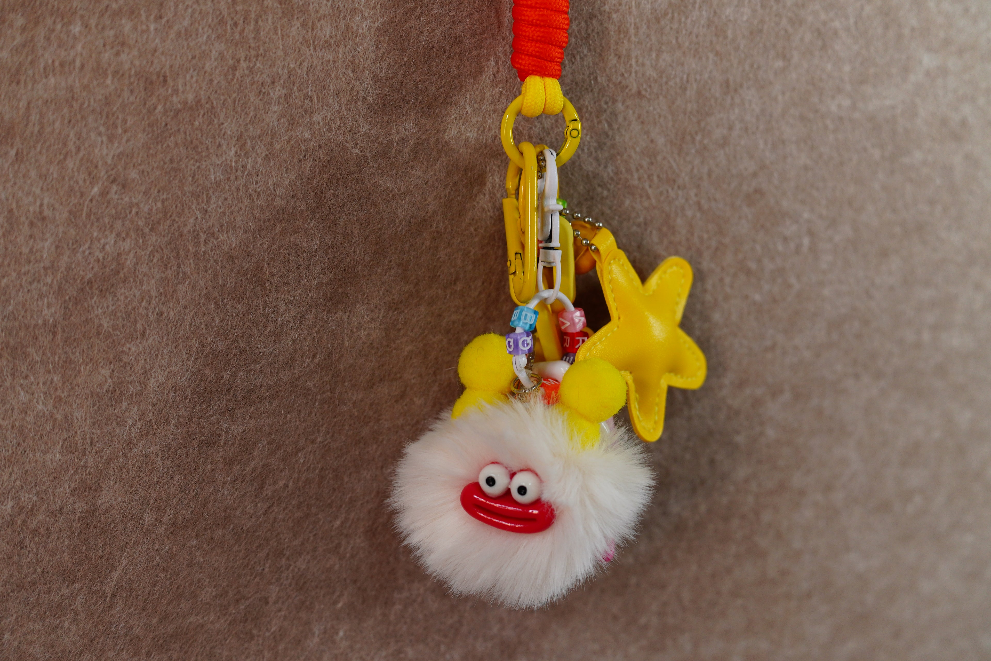 Beige briquettes and yellow star keychain