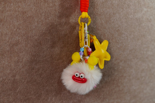 Beige briquettes and yellow star keychain