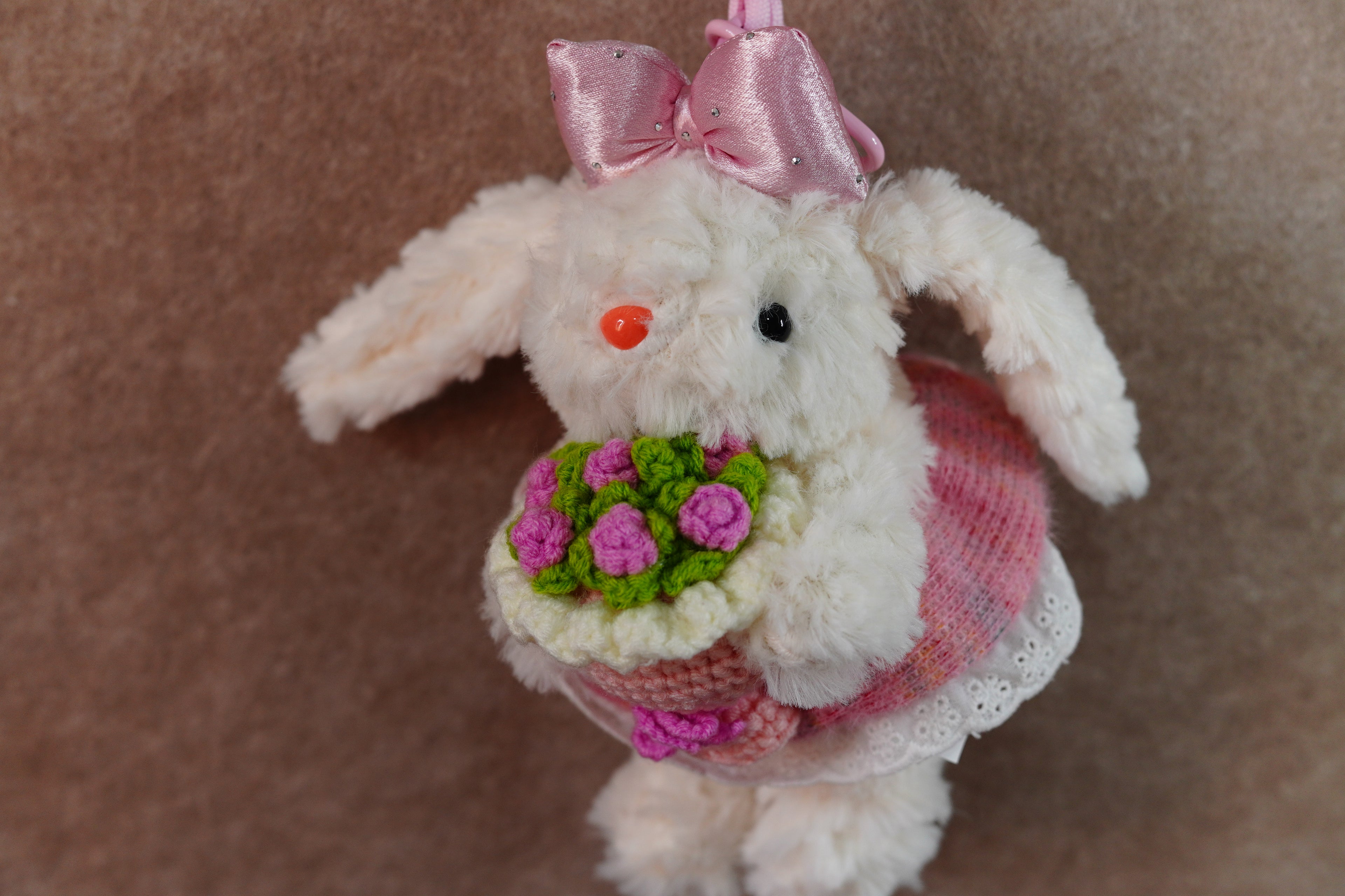 Recordable Pink lop-eared rabbit holding flowers